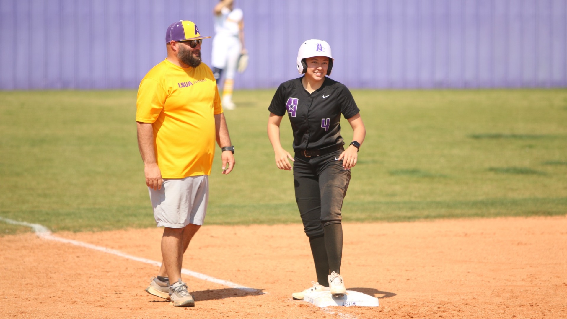 Hayden Cary smiles after hitting a triple against Texas College