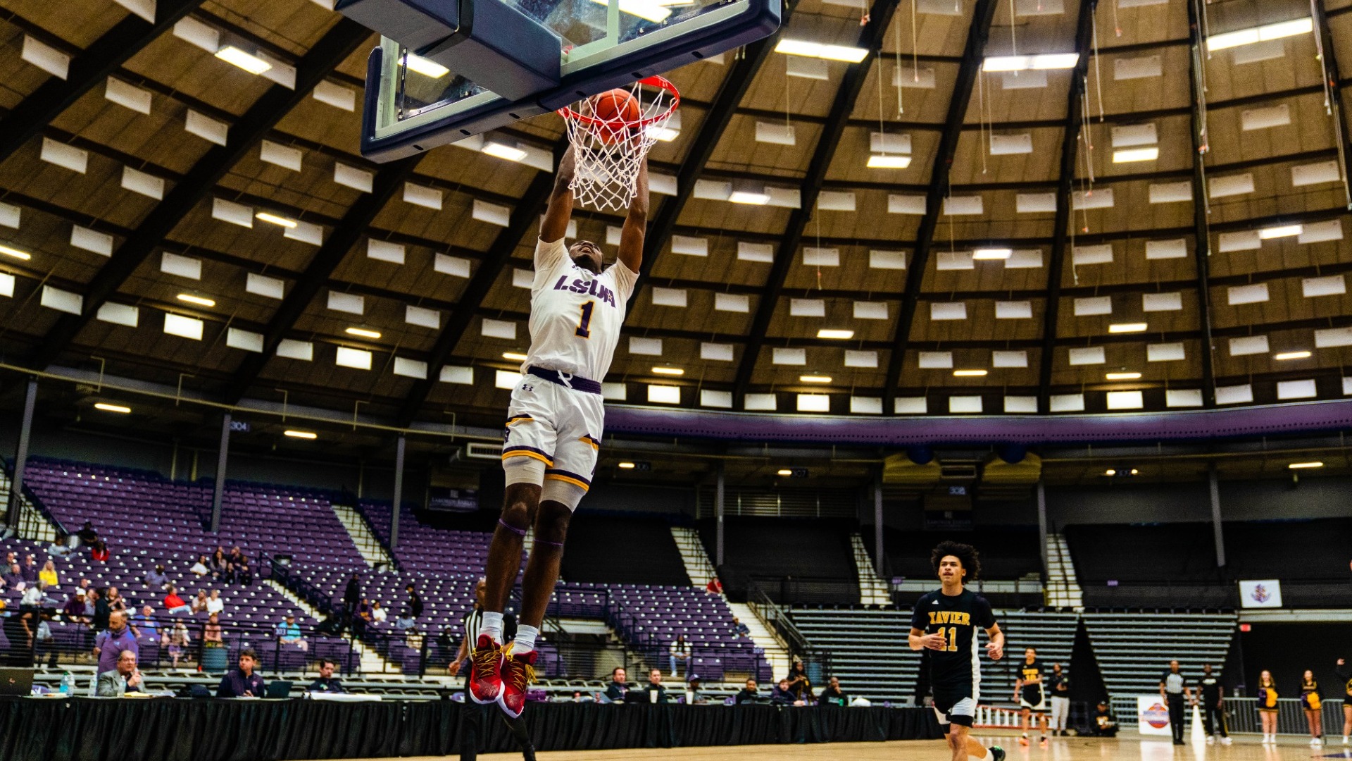 EJ McQuillan dunks the ball during the RRAC Semifinal against XULA
