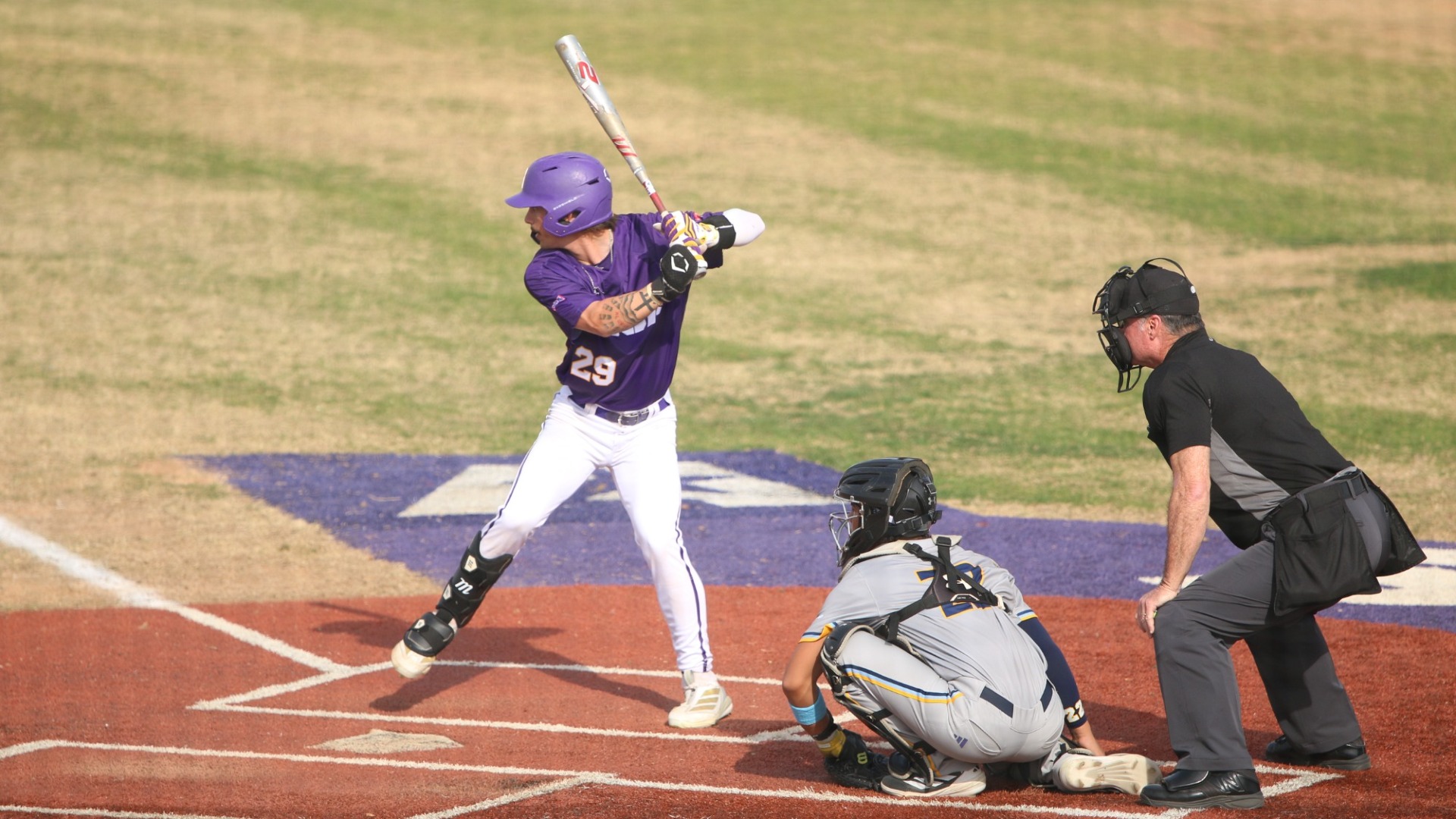 Lane Kratzer strides while tracking a pitch against SUNO