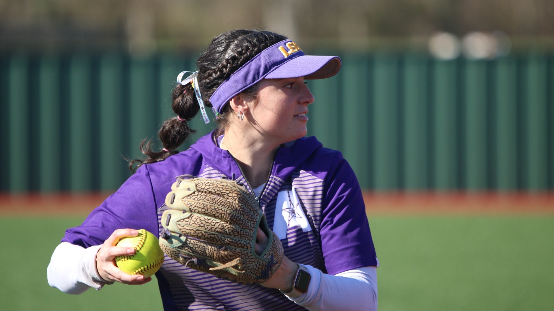 Haley Fontenot playing catch prior to a game against Nelson