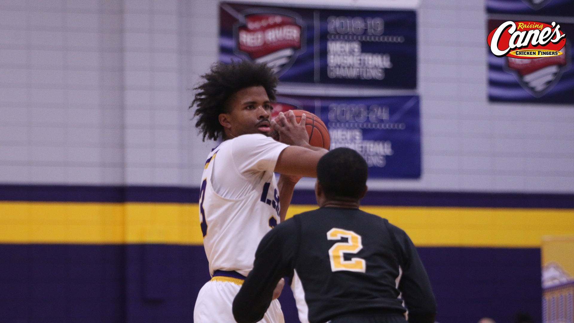 Jordan Decuir shields the ball from a defender