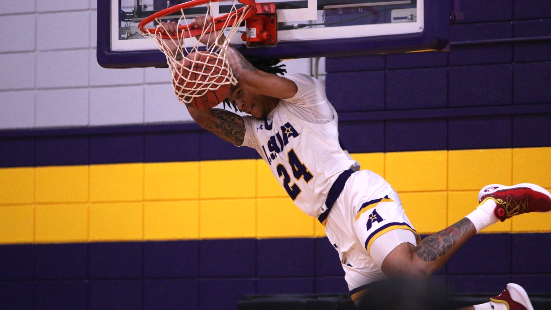 TJ James slams down a dunk against Texas College