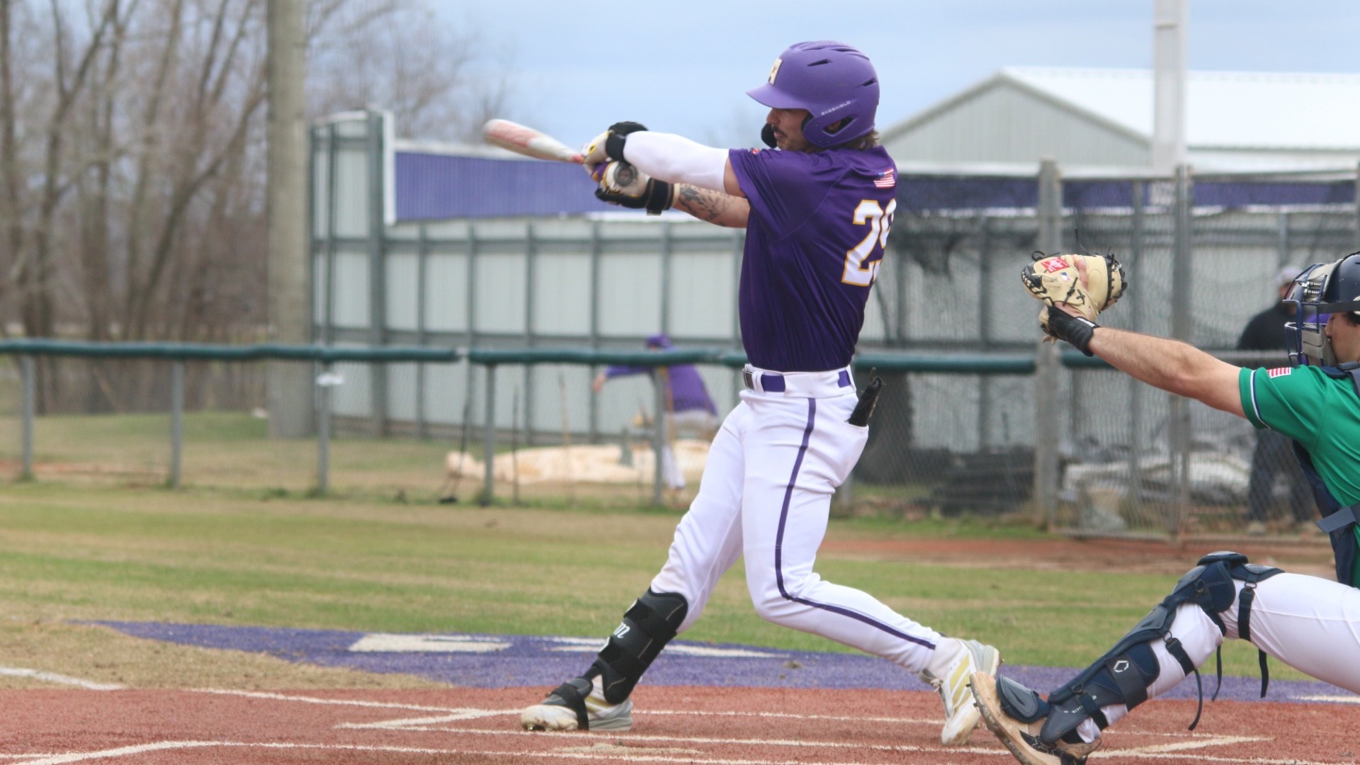 Lane Kratzer hits a pitch during a game against John Melvin