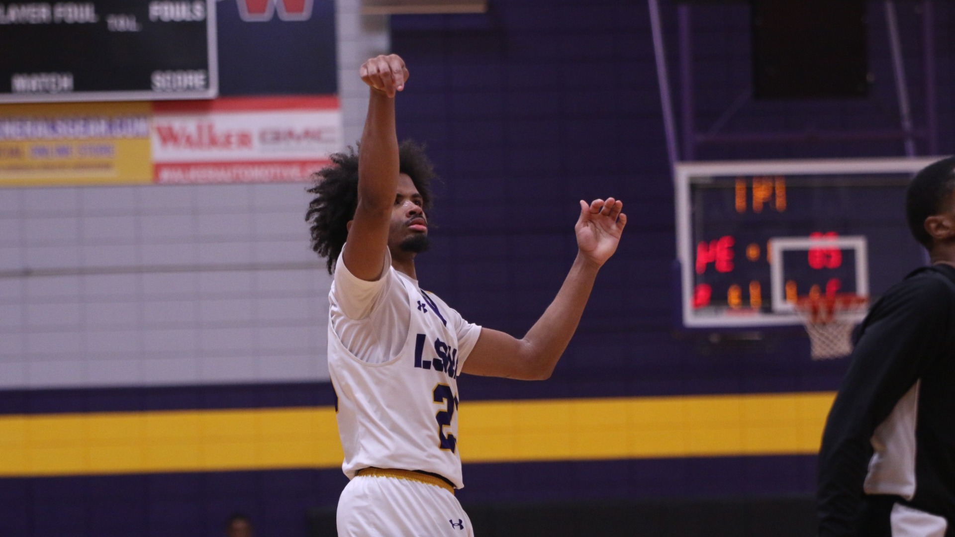 Jordan Decuir watches a three attempt after shooting