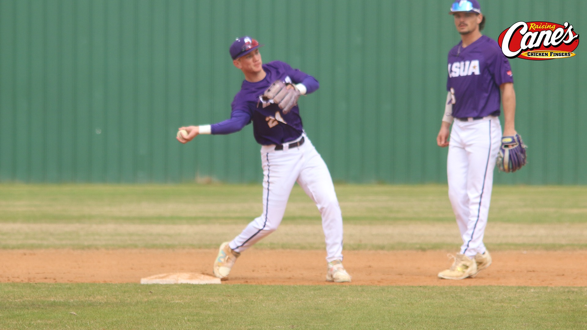 Landon Langley throws to first during pregame 