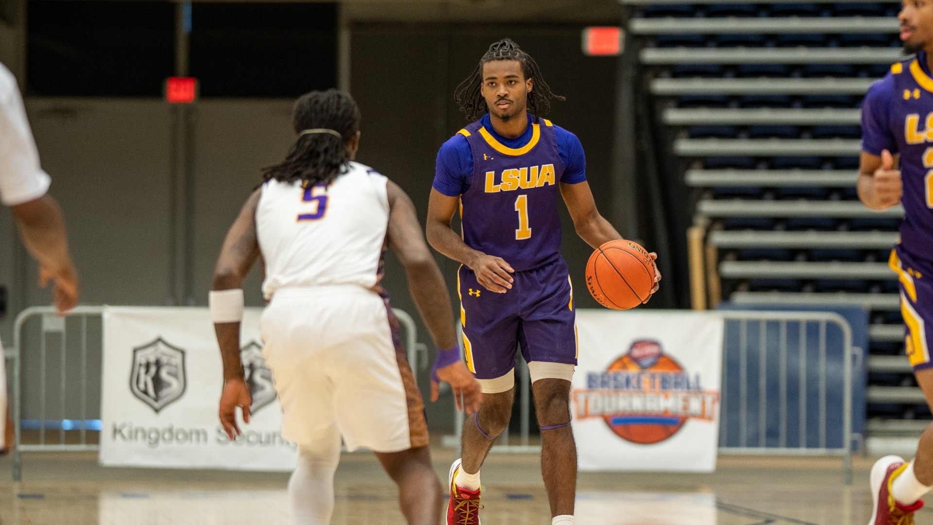 EJ McQuillan dribbles up court during the RRAC Final against LSU Shreveport