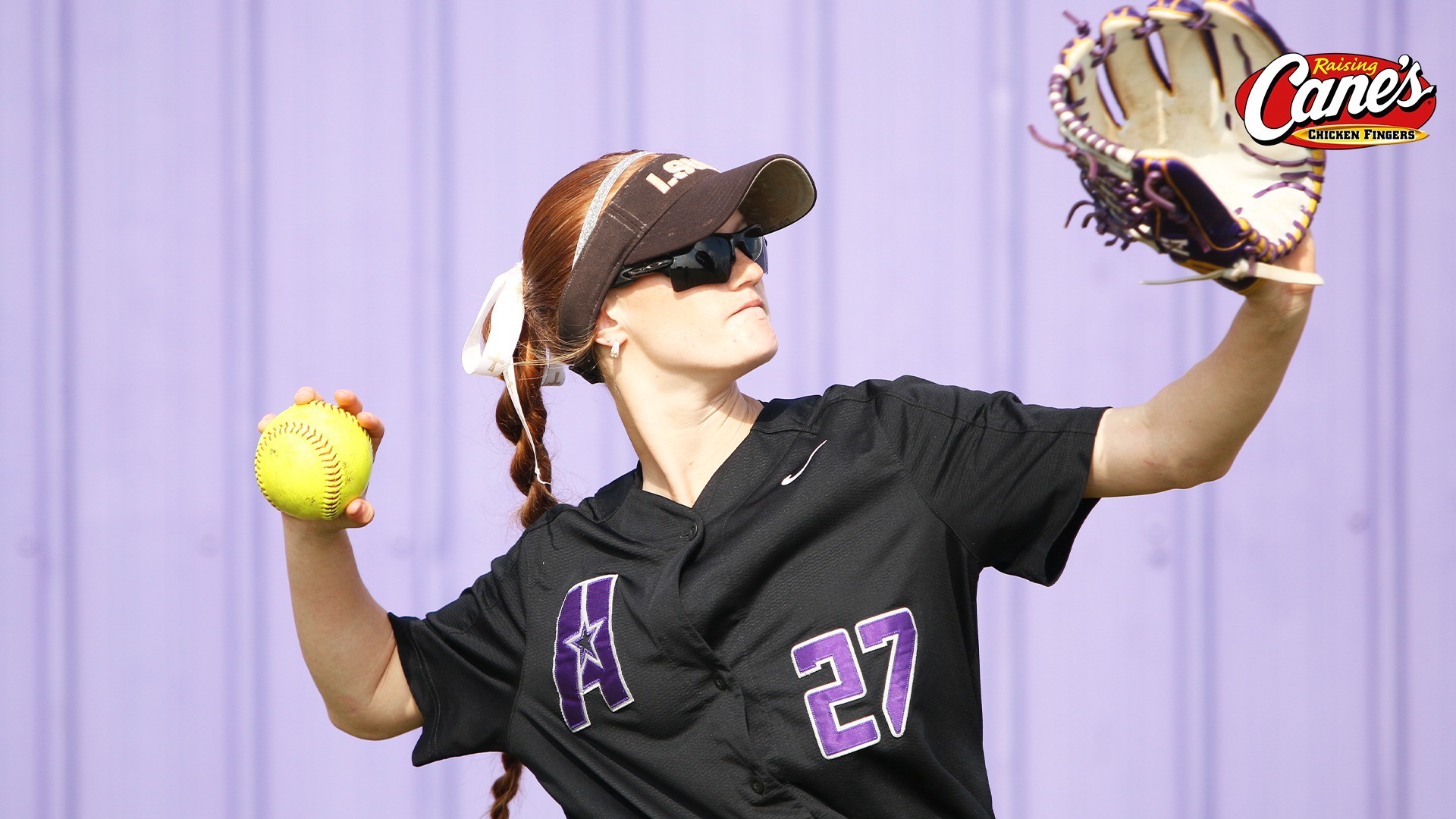 Ryleigh Moran gets ready to make a throw while playing catch in the outfield
