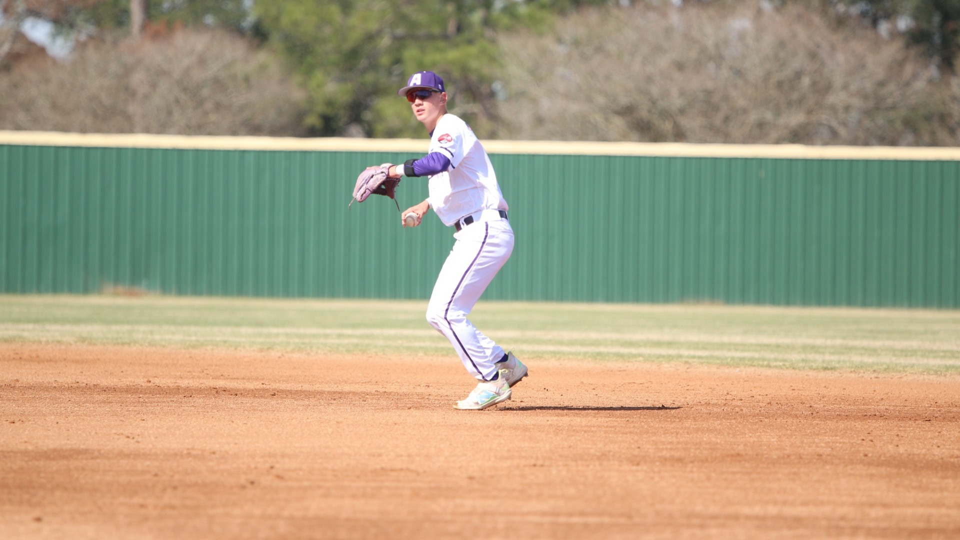 Landon Langley makes a throw to first base