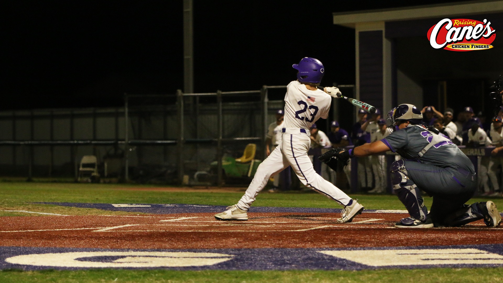 Joshua Tinnerello swings at a pitch during a night game against LSU Shreveport