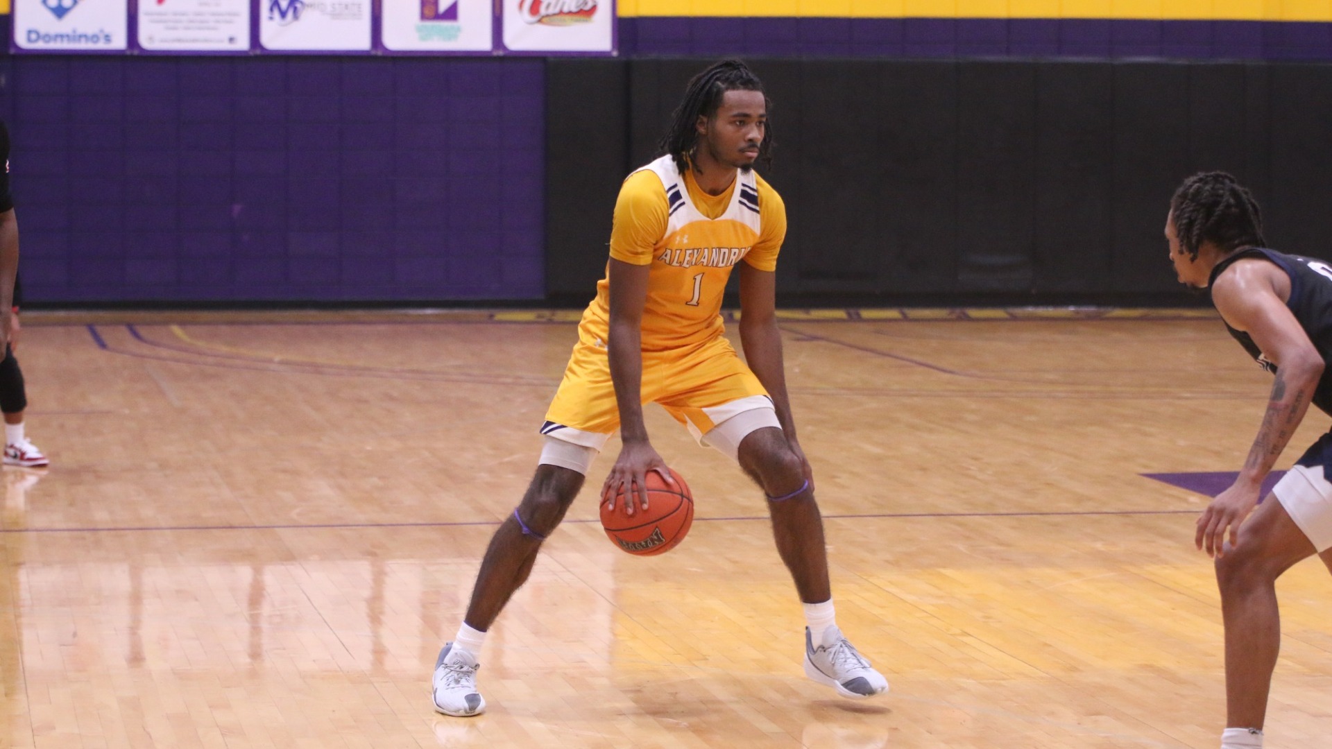 EJ McQuillan dribbles against Texas A&M-Texarkana