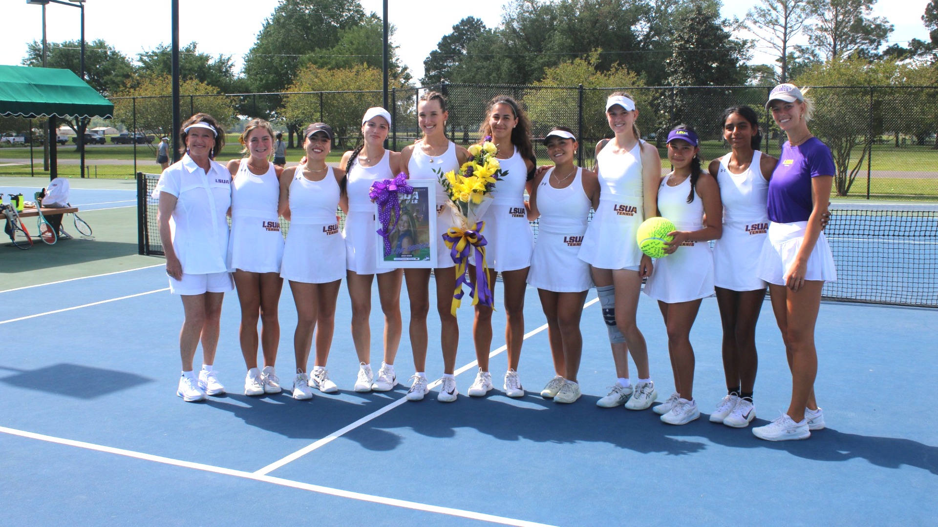 Joline Roesch smiles during her senior day celebration, surrounded by teammates