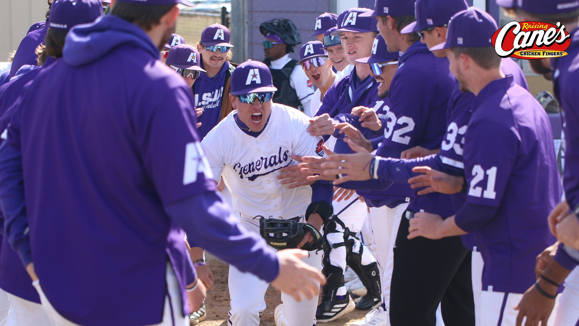 Trevor Dooley runs out of the tunnel of teammates during introductions before a game
