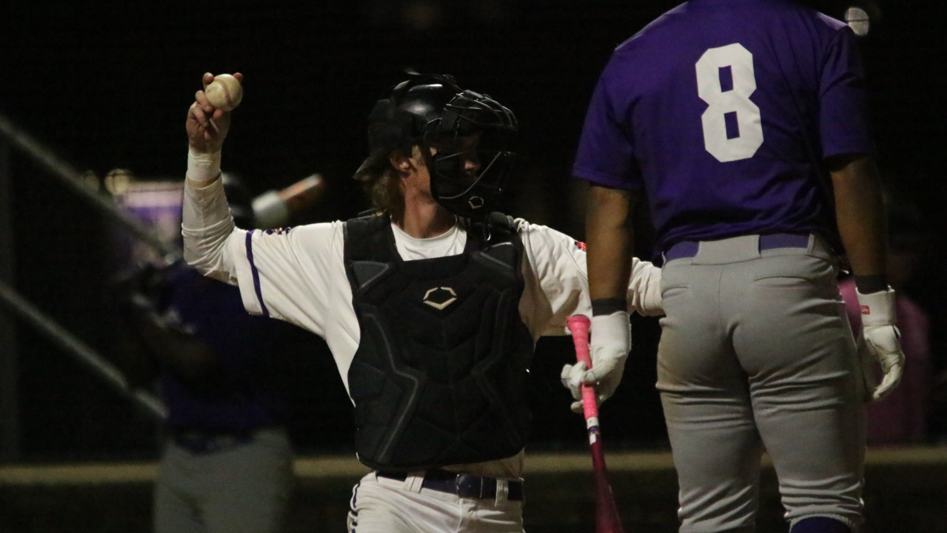 Evan Rohlfs-Schadel throws back to the pitcher during a game