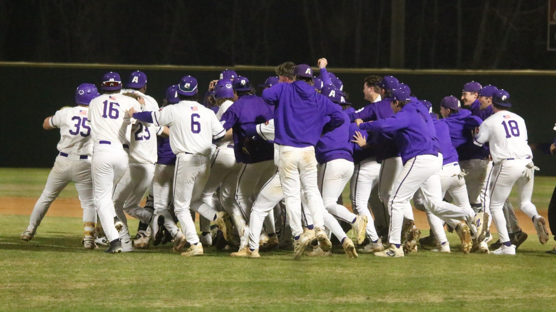 Baseball Team Celebrates after a walk-off win over Wiley