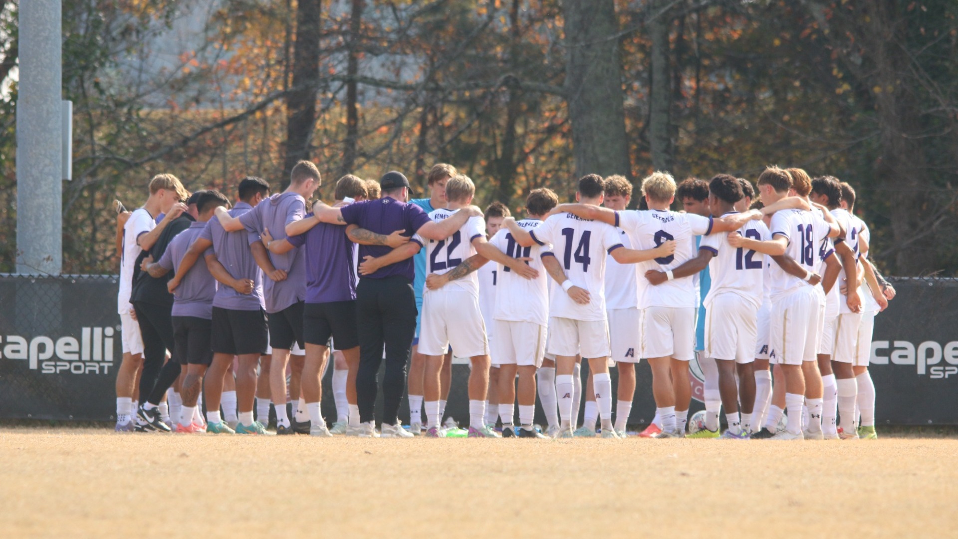 The men's soccer team huddles prior to their NAIA playoff game against Milligan