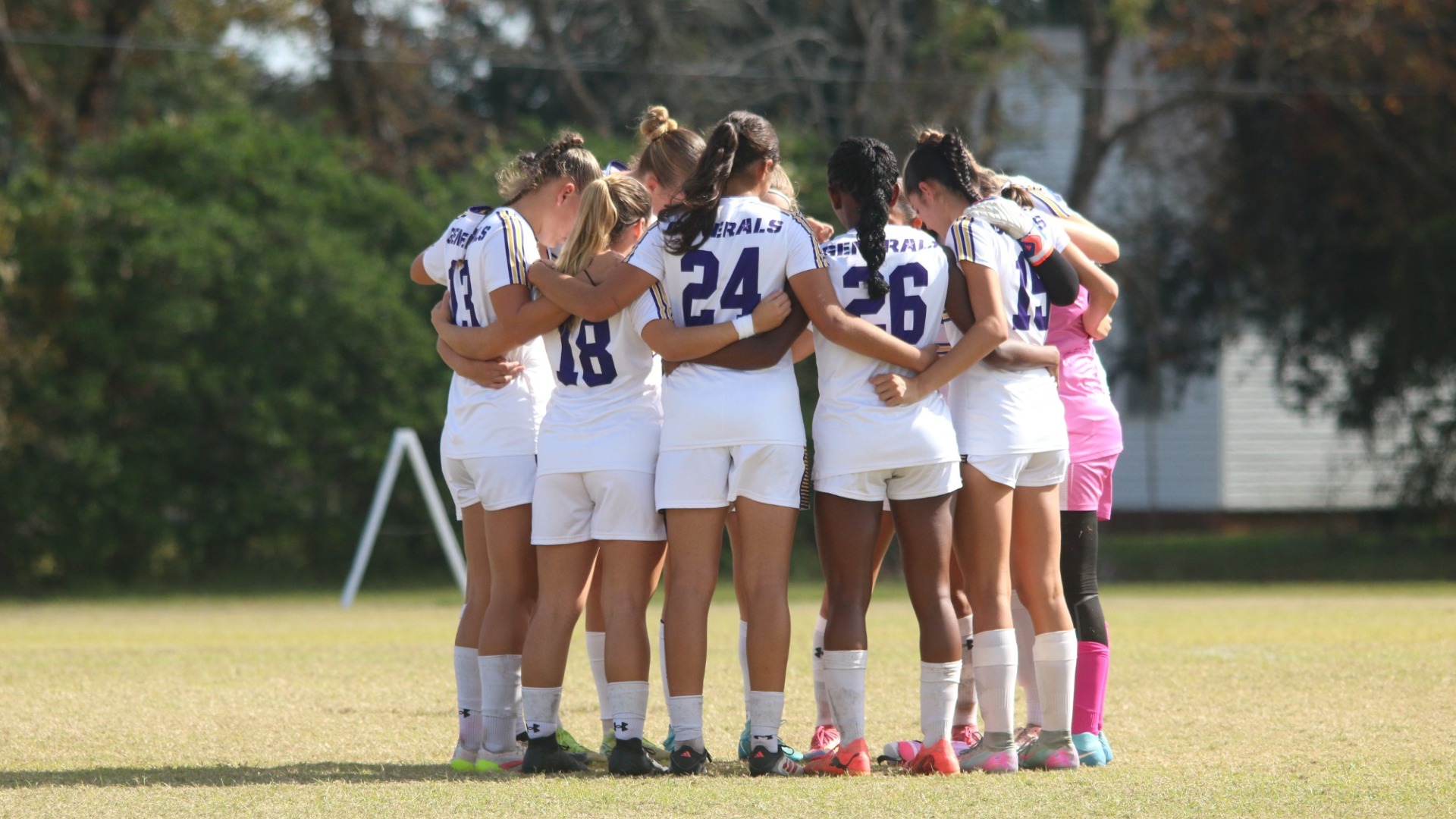 The women's soccer team huddles prior to their RRAC quarterfinal against Texas A&M-Texarkana