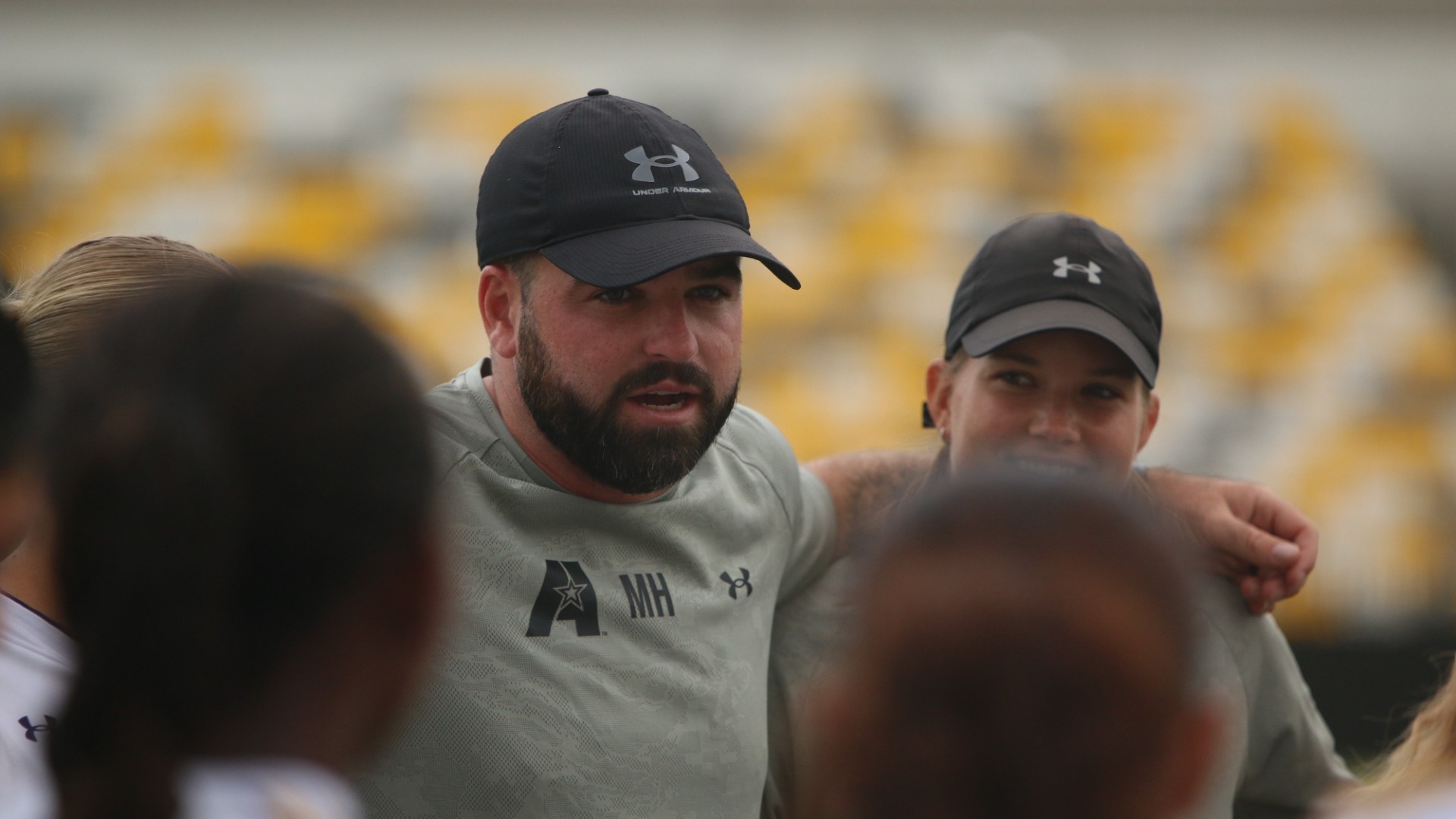 Mark Hammond delivers a pregame speech ahead of a game at North American University