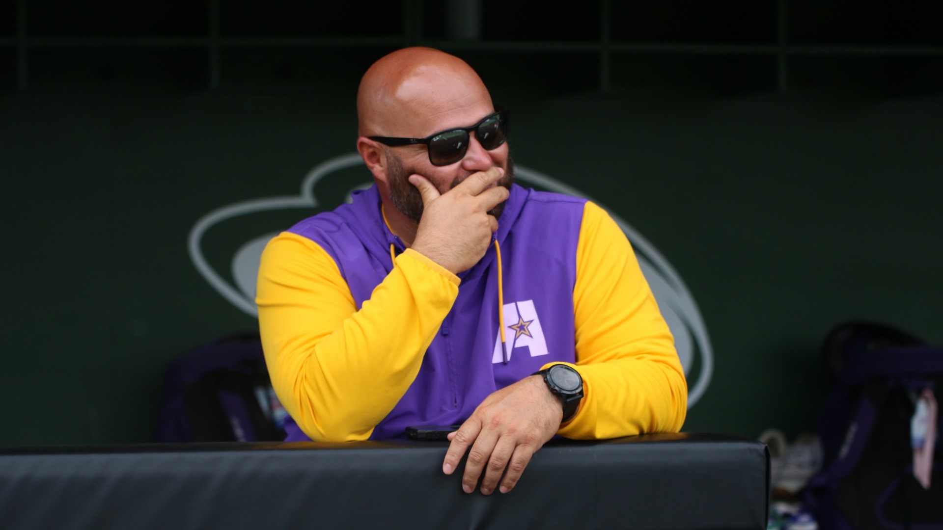 Brannin Hagan leans on the dugout rail during a practice at the NAIA Fayette Regional is 2025