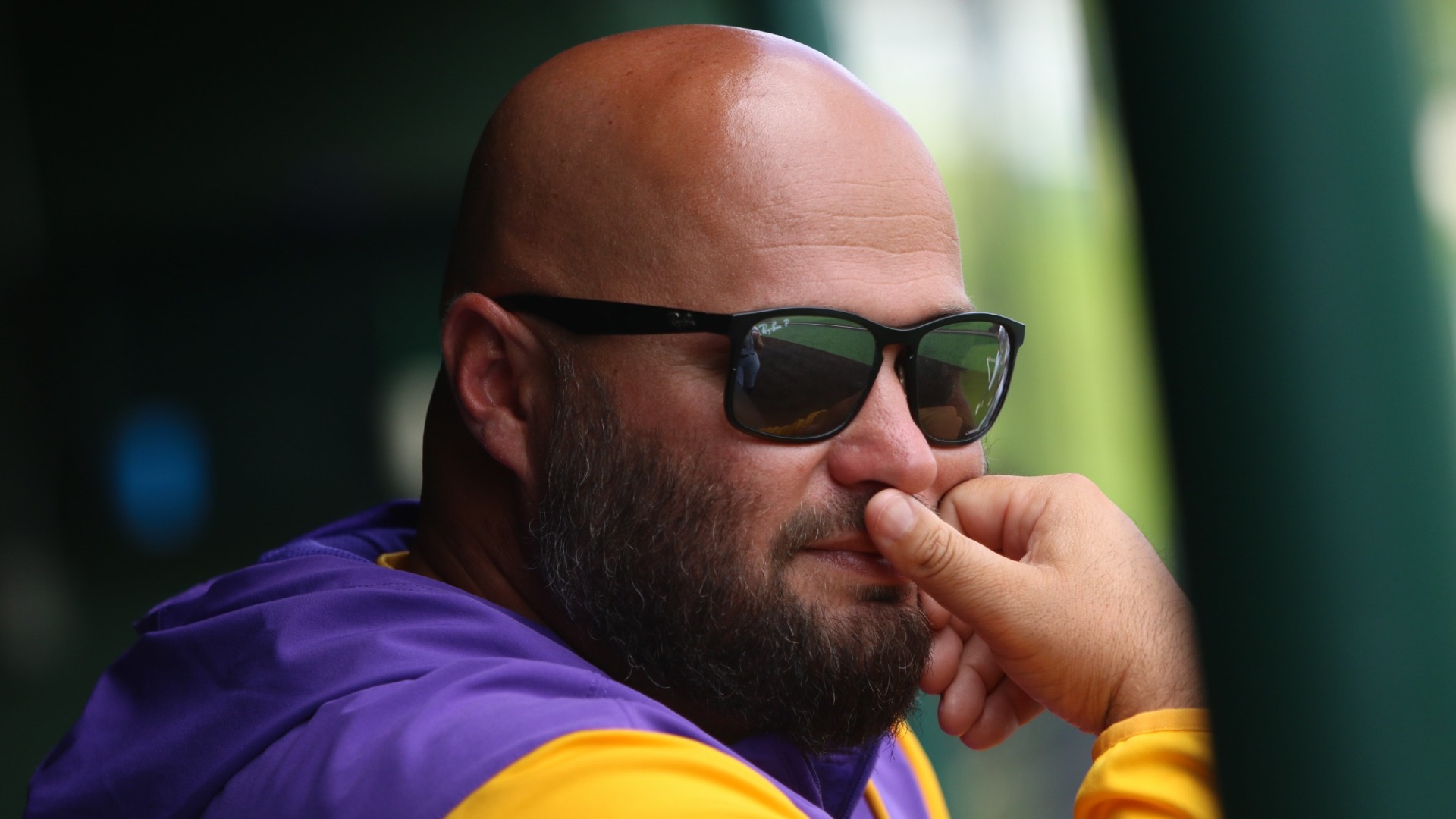 Brannin Hagan leans on the rail in the dugout 