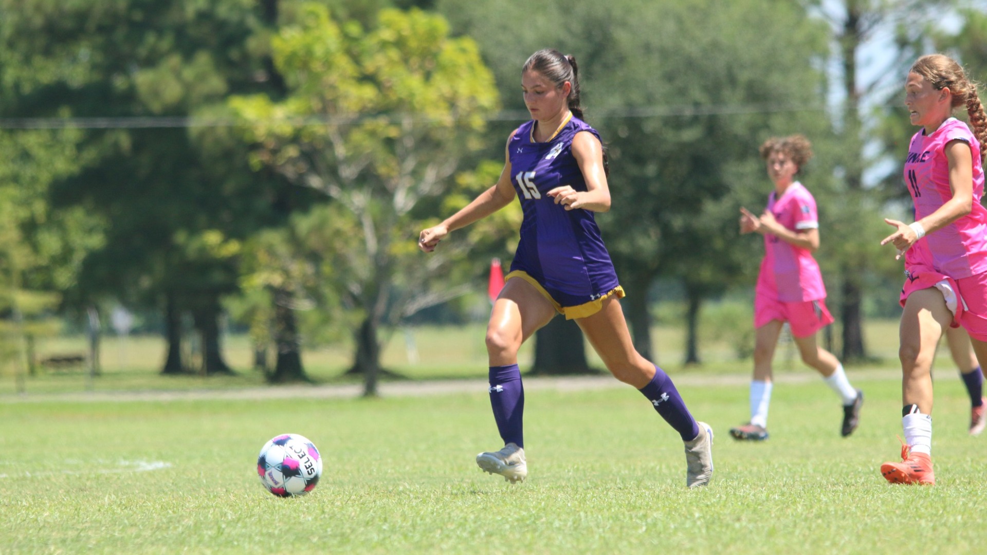 Ariana Lowenstein dribbles through the midfield during a game