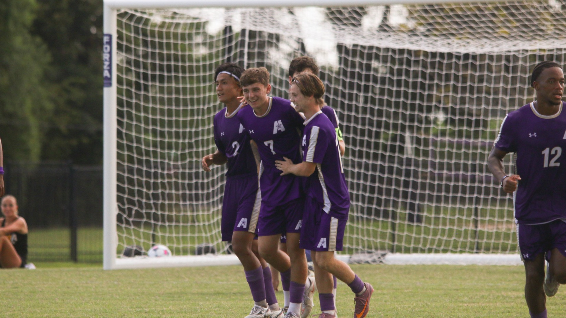 Lucas O'Donnell celebrates with teammates after scoring against OCU