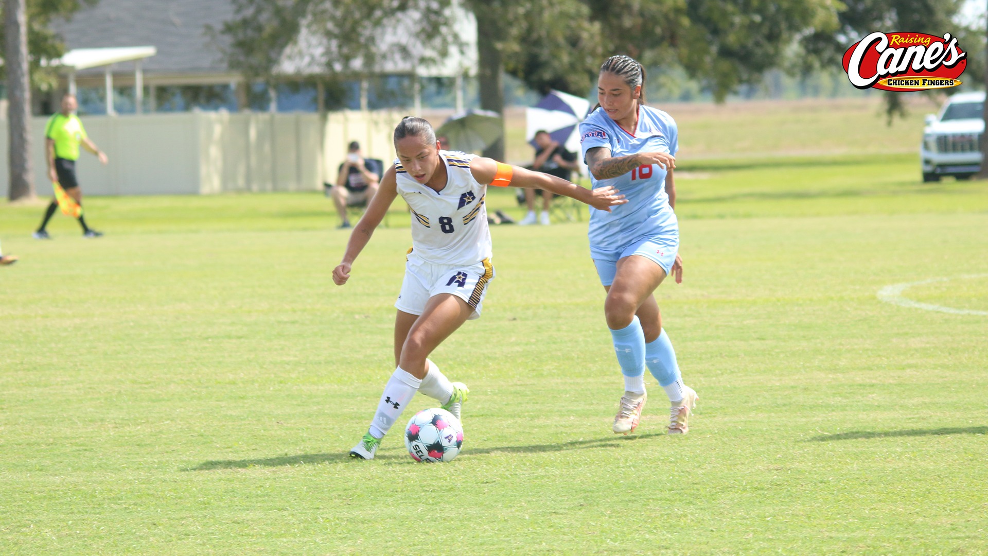 Nelly Dallmann defends the ball from an opposing player