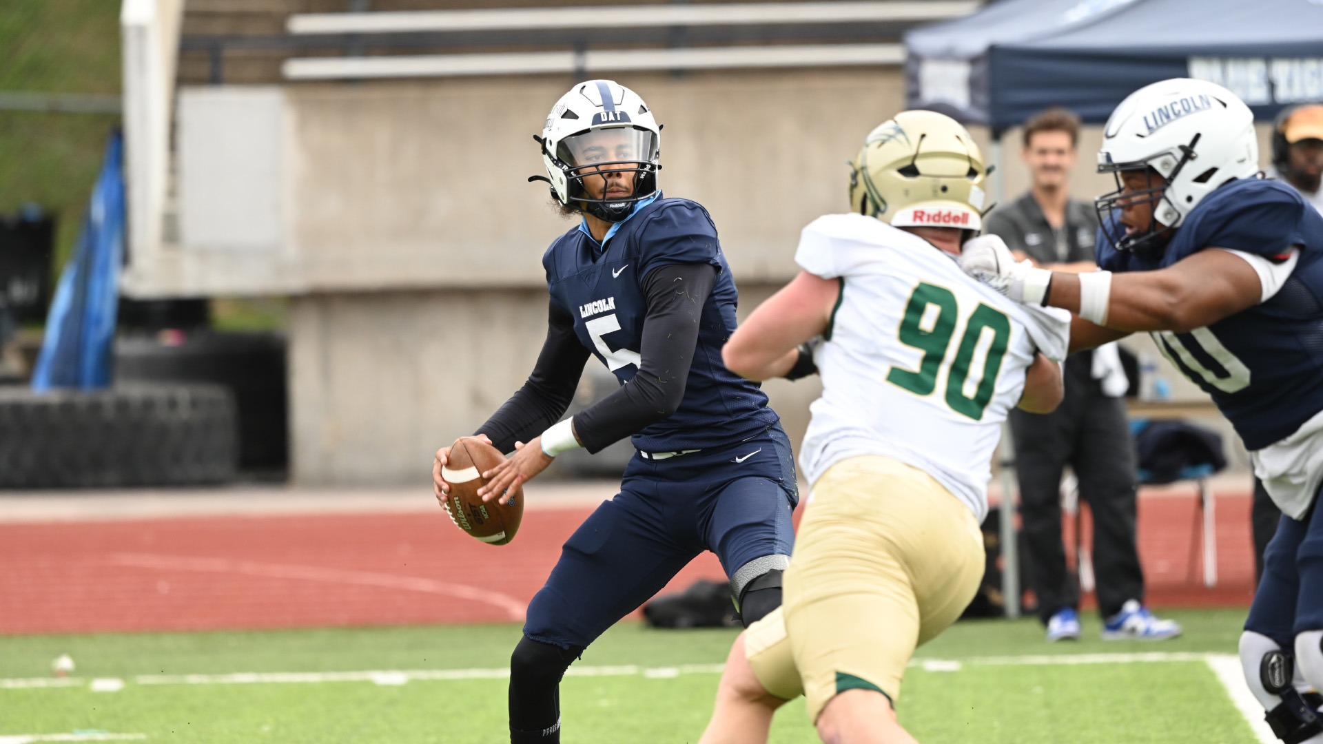 Khi'Len Gates Blocks as Jaylen Thomas Throws a Pass (Photo courtesy of Ryan Luttrell)