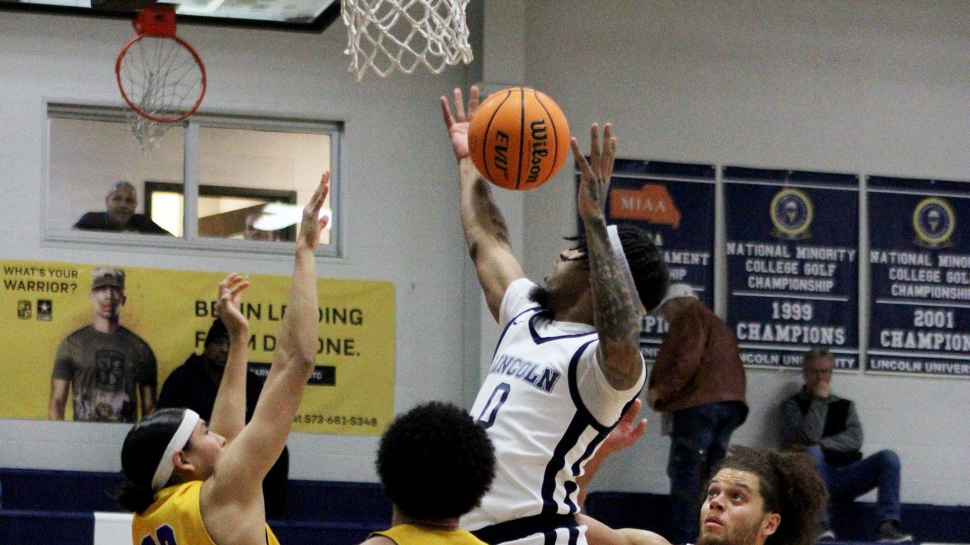 Solomon Oraegbu Leaps for an Offensive Rebound Against Haskell (Photo by Caroline Glydewell)