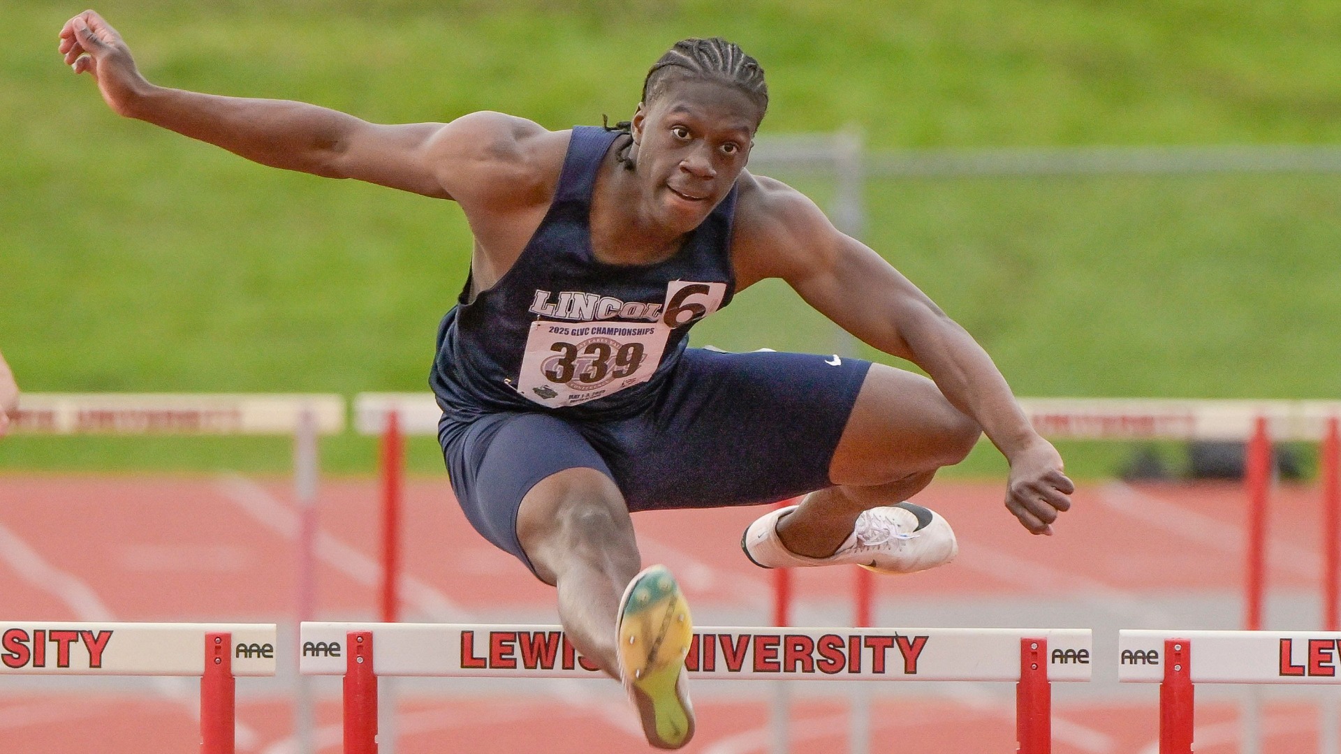 Joshua Dottin Jumping Over a Hurdle During the 2024-25 Track & Field Season