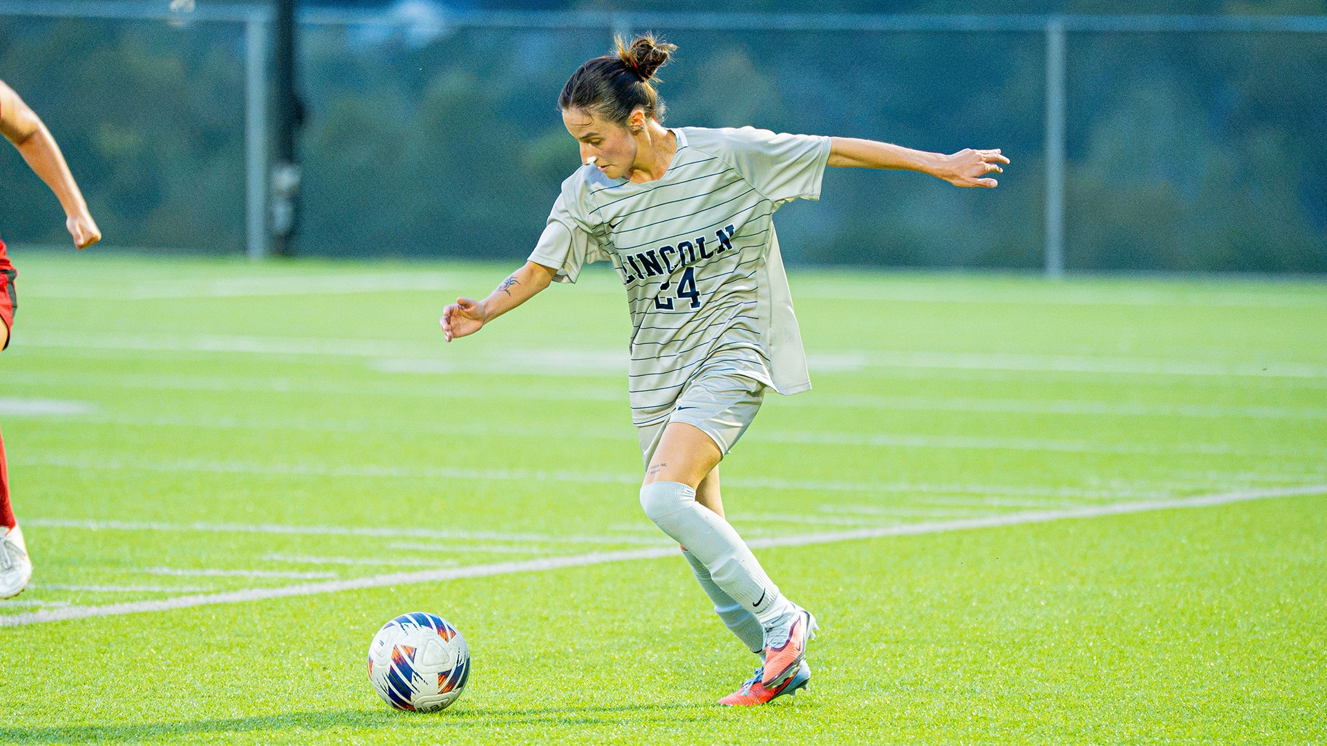 Sofia Valdivia kicks the ball down the field in a home match against William Jewell.