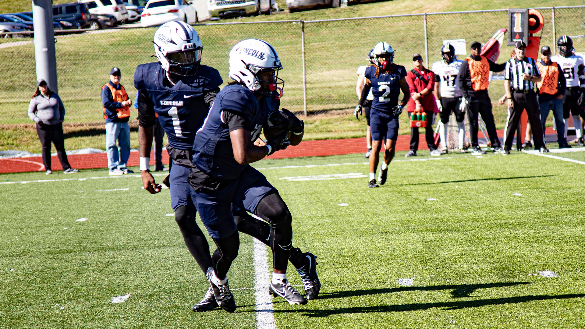 Donnie Trice-Jamison Takes a Hand Off in a Home Game Against Indianapolis