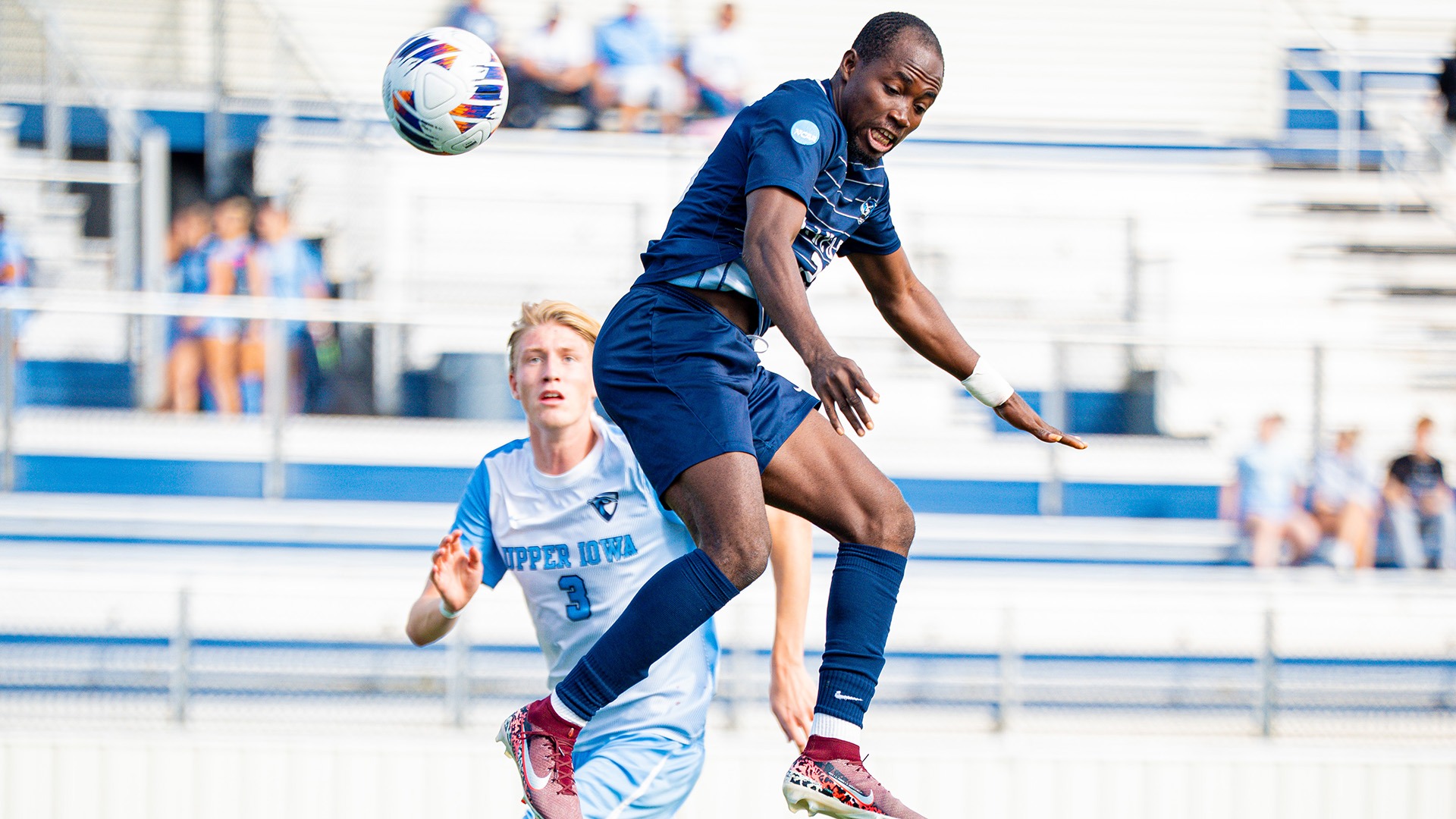 Jonathan Nemorden goes up in the air to head the ball in a game against Upper Iowa.