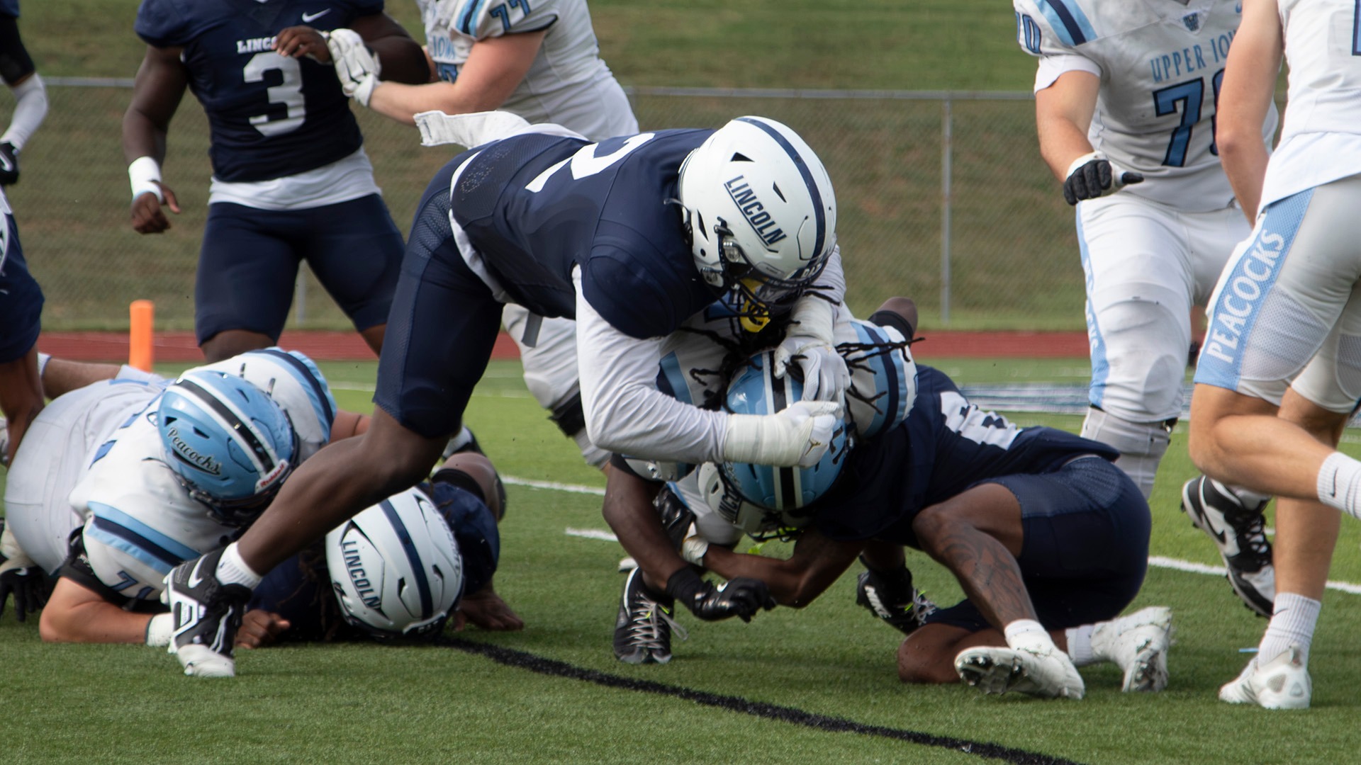 Marion Slater makes a tackle during Lincoln's win over Upper Iowa in 2026.