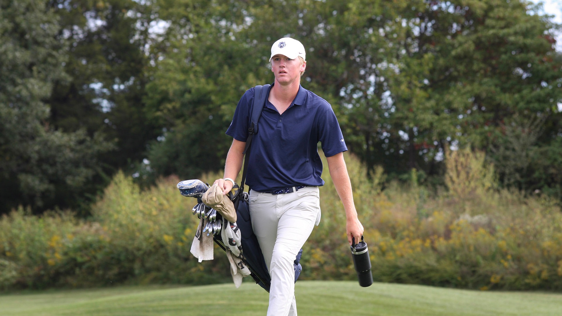 Archer McDaris walks to the next hole during a tournament in 2026-27.
