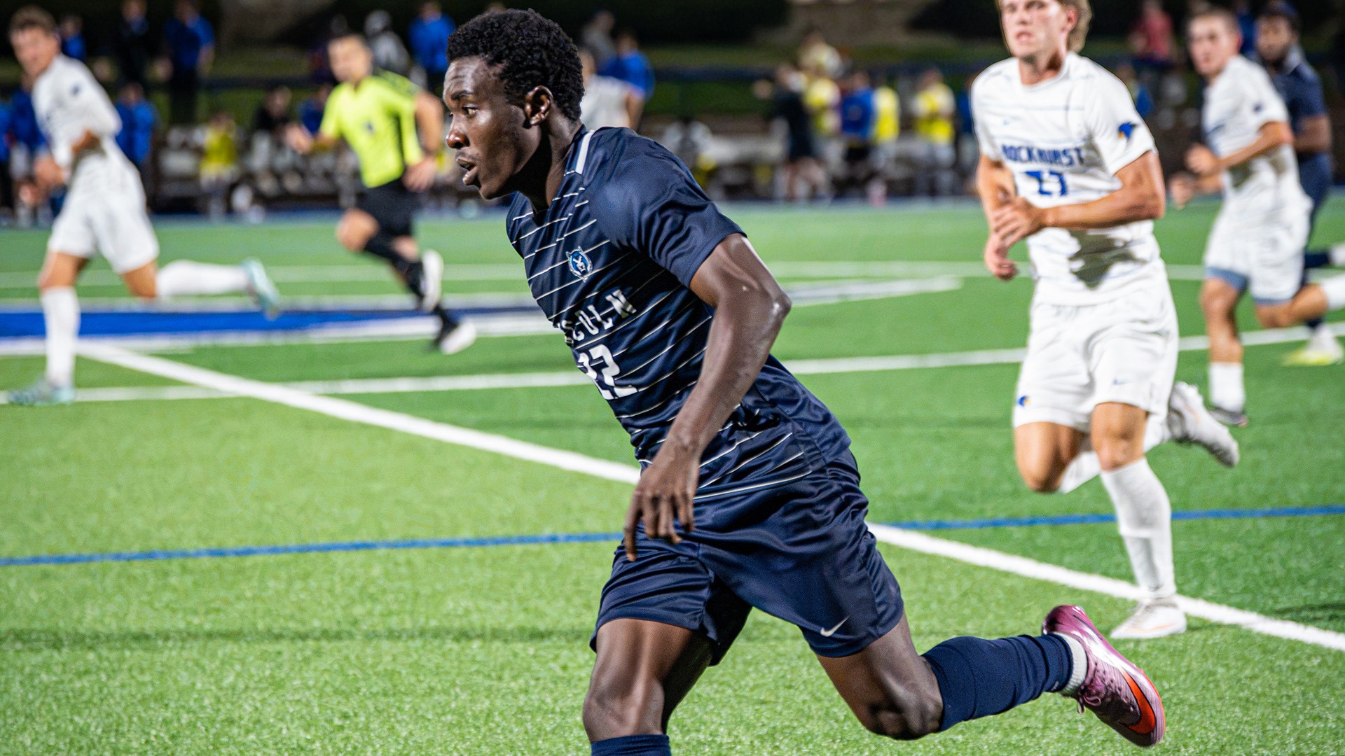 Jerome Lawel races down the field in Lincoln's win at Rockhurst in 2026.