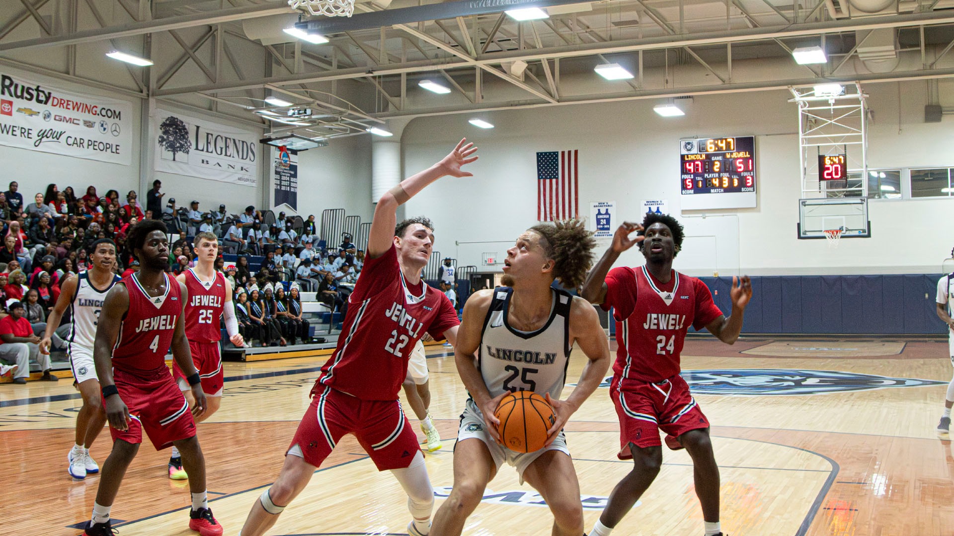 Max Ekono Tries to Drive to the Basket Against William Jewell in Jason Gym