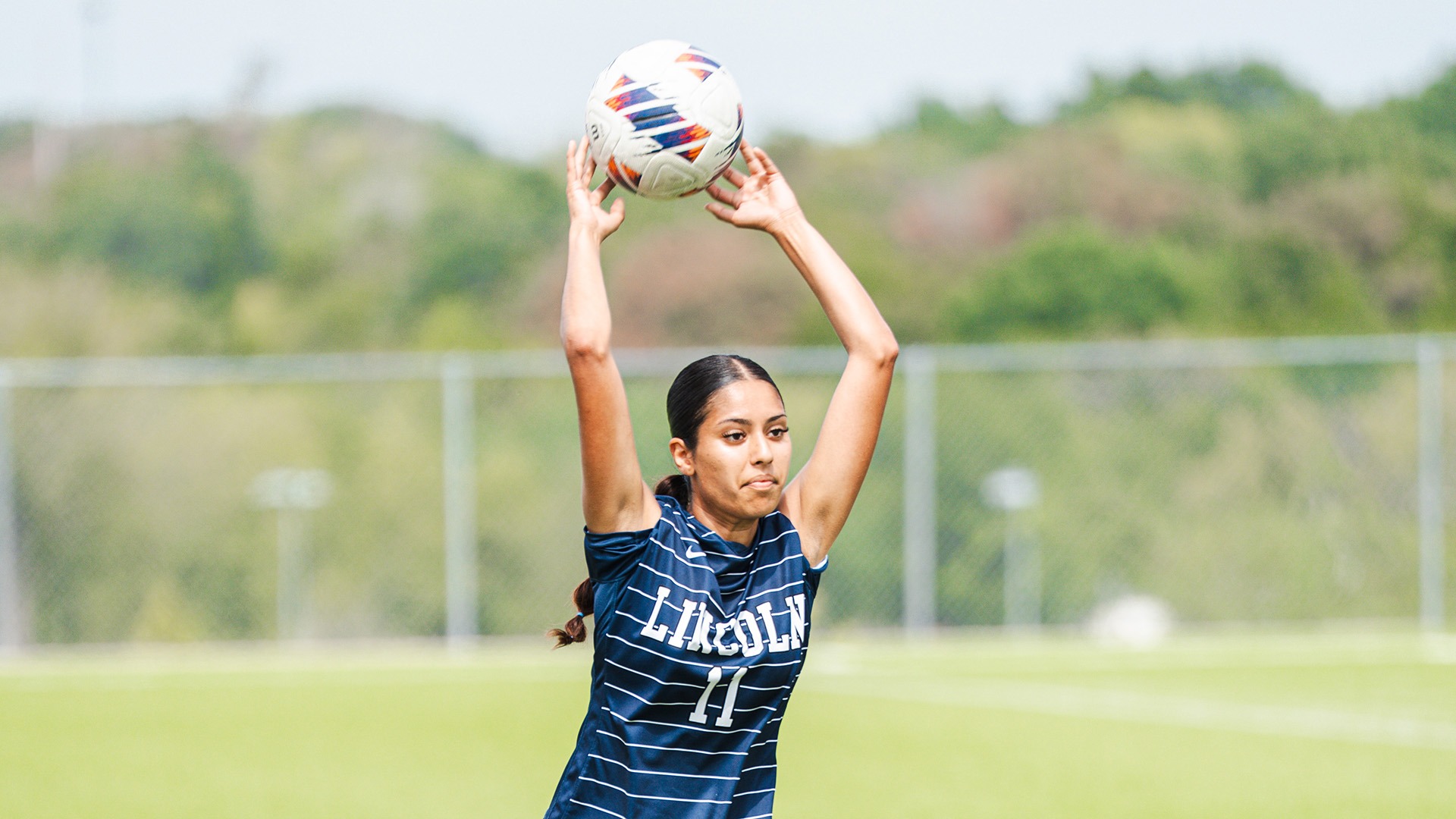 Vanessa Dagher Throws the Ball in From the Sideline Against Southwest Baptist