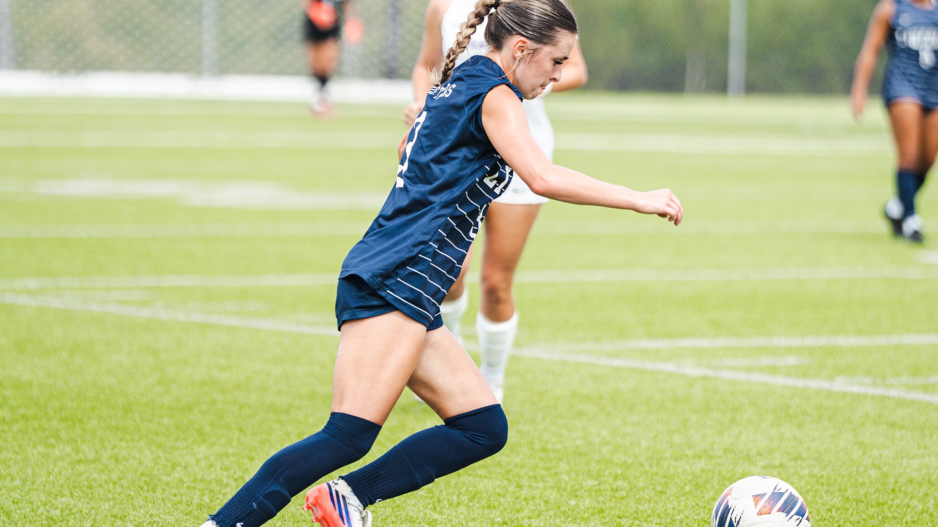 Mia Greathouse Takes the Ball Past a Southwest Baptist Defender in a 2026 Home Match