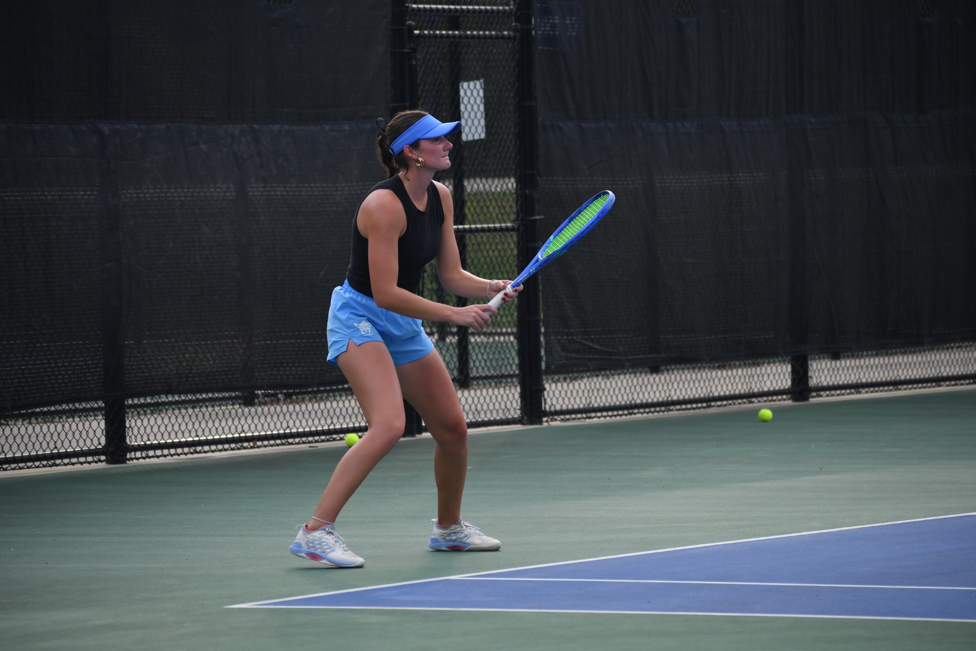 Allie Christensen playing singles. 