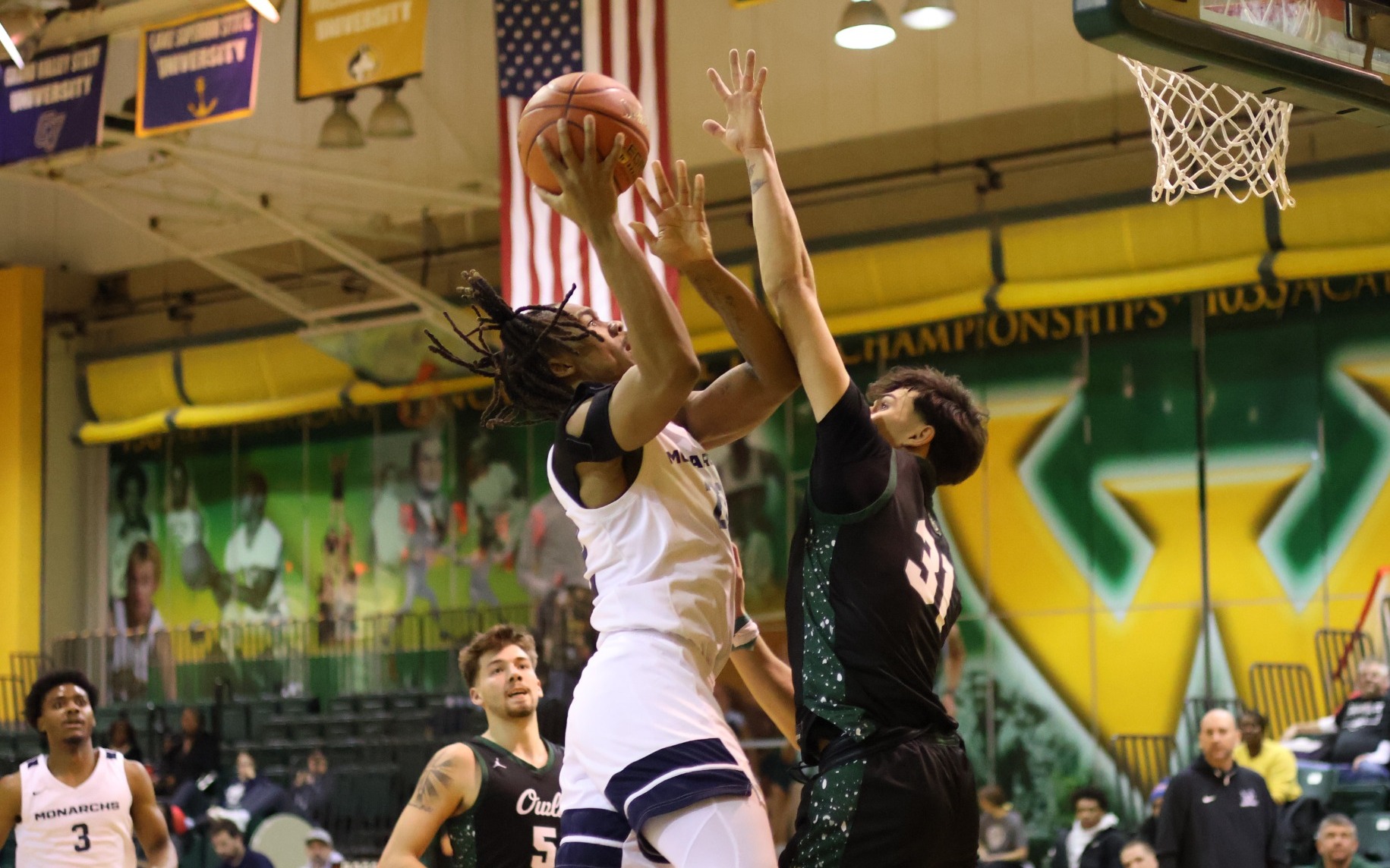 MBB - Caron Williams (22) connects with an and-one as part of his team-high 19 points in Macomb's win over OCC (Jan. 24, 2026)
