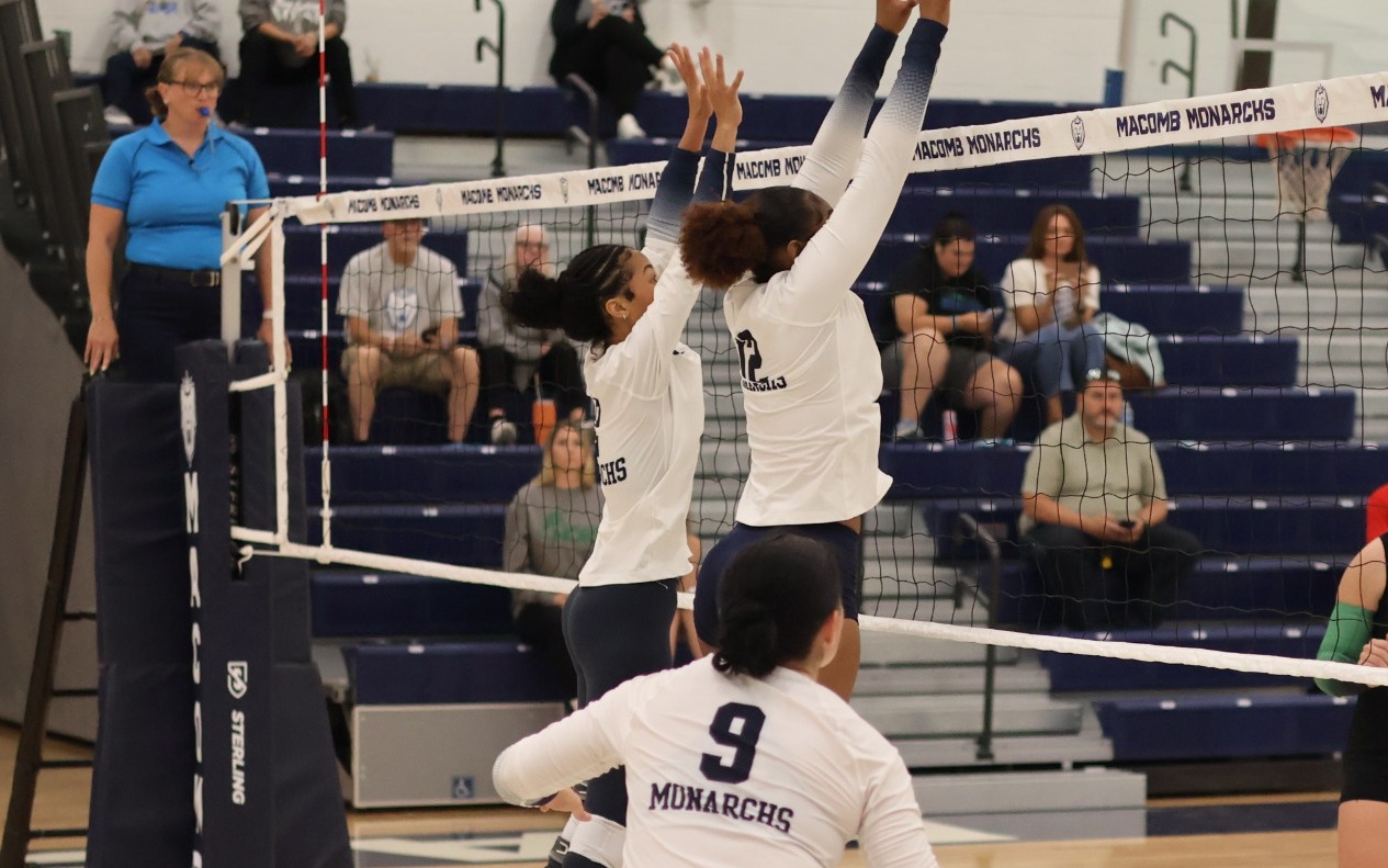VB - Brooke Baker (2) and Bethany Dean (12) go up for a block assist while Korin Hutton (9) looks on