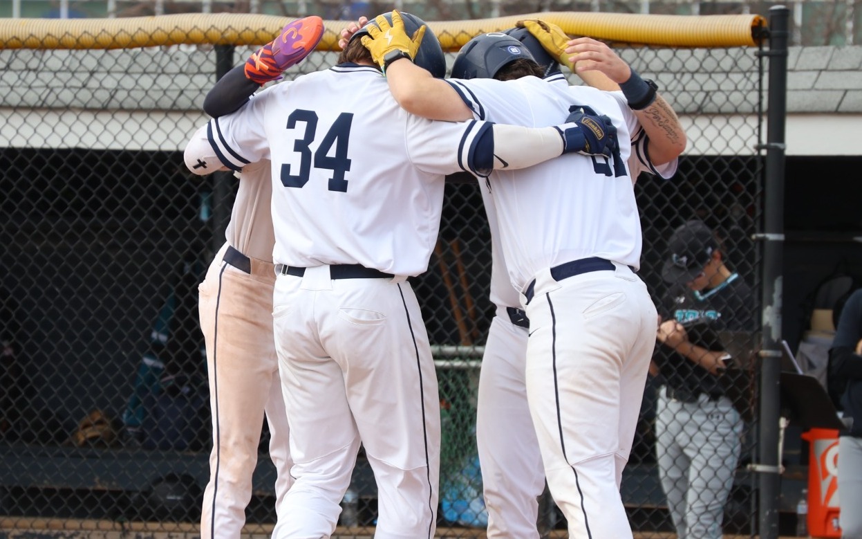 Baseball - Lochlan Stoudt (34) is greeted by teammates after his 3-run blast in the fourth inning (March 30, 2026)