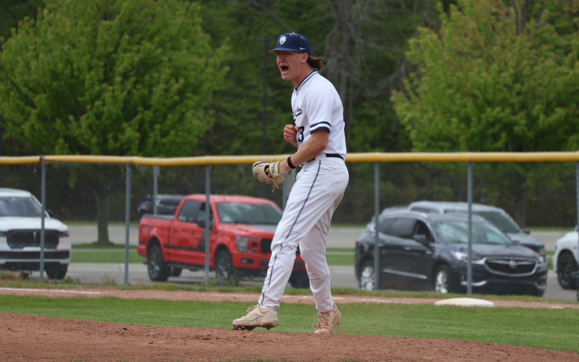 Baseball - Johnathan Meyette (13) celebrates a key strikeout against Mott on May 7, 2026
