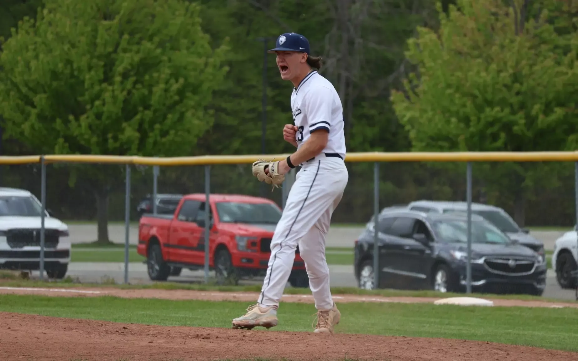 Baseball - Johnathan Meyette (13) celebrates a key strikeout against Mott on May 7, 2026