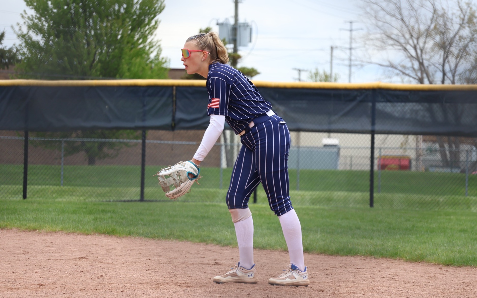 Softball - Aubrey Rich (9) readies for the pitch at second base
