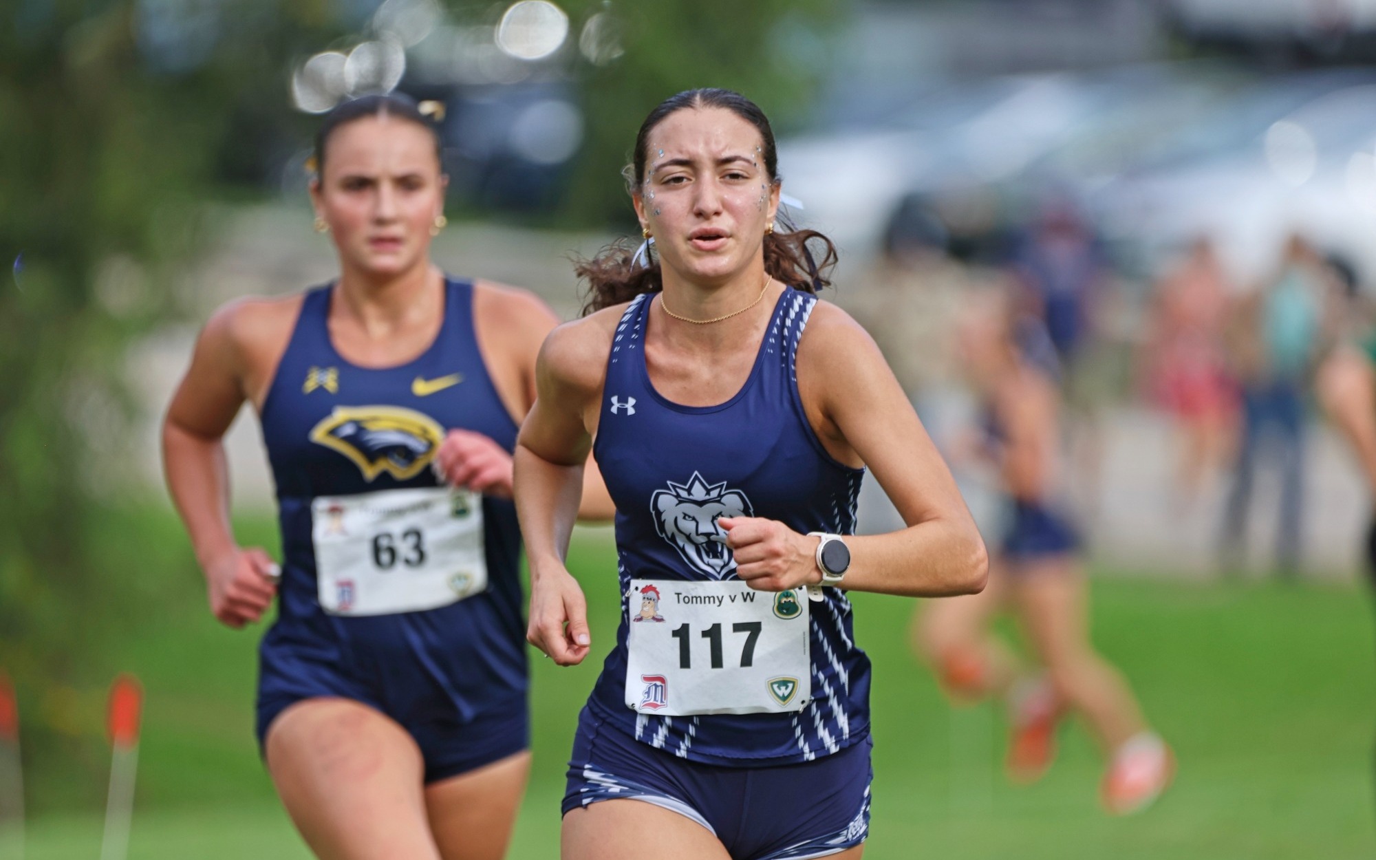 WXC - Laila Evola pushes in front of a Spring Arbor University runner at the Tommy Titan vs. W the Warrior Classic on Sept. 12, 2026