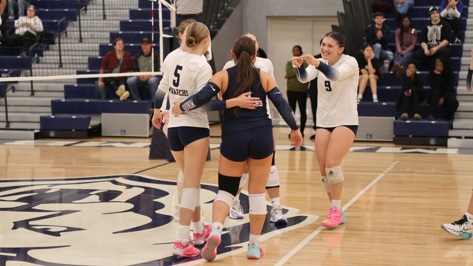 Volleyball - Korin Hutton (9) celebrates with teammates following a point won by the Monarchs (Sept. 21, 2026)