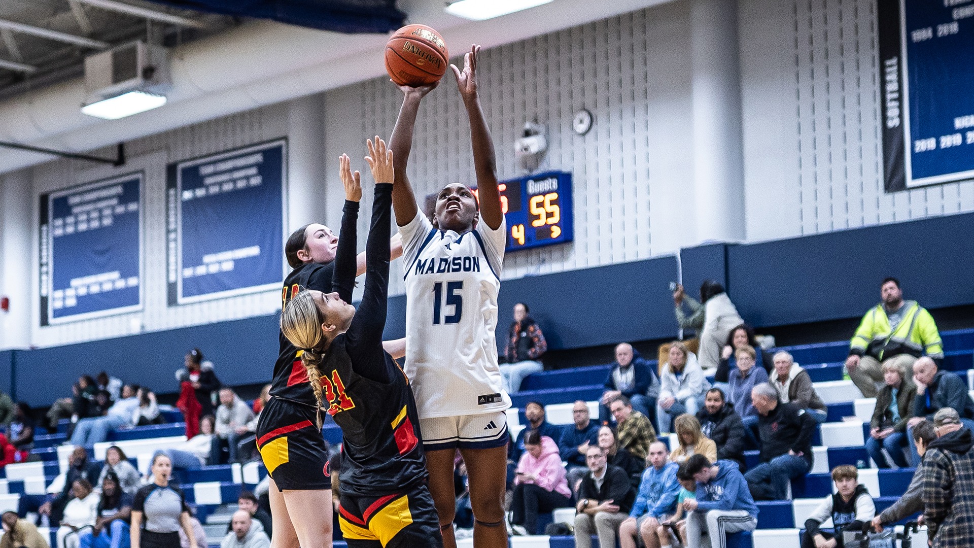 Amaya Travis shoots over two defenders