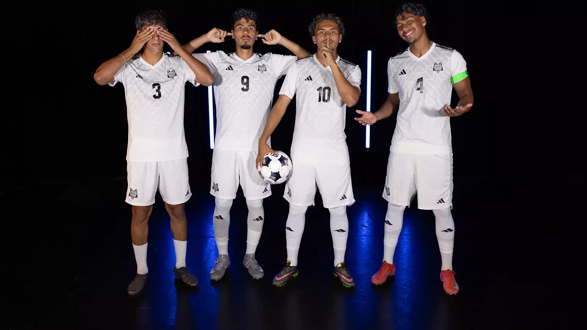 Four members of the 2025 men's soccer team have fun with 