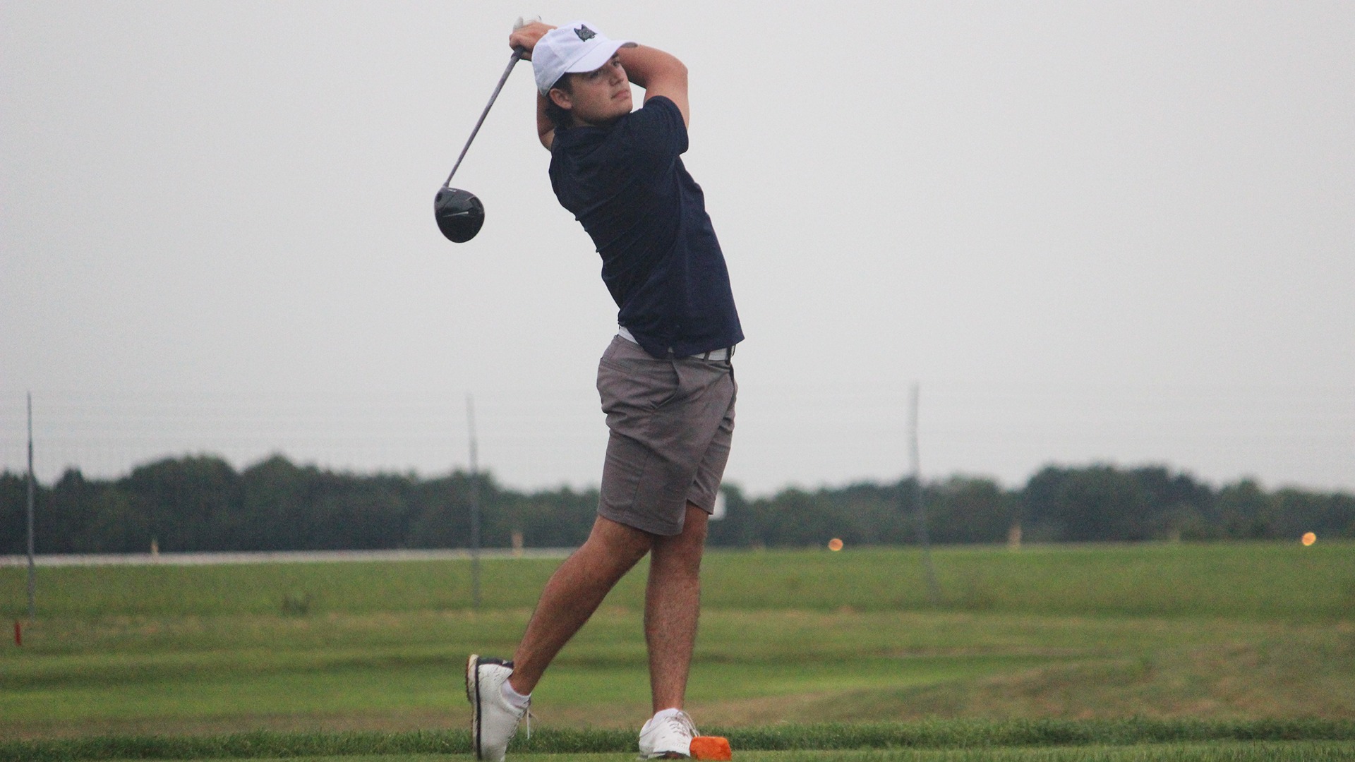 Matthew Haggart holds his follow through after a tee shot